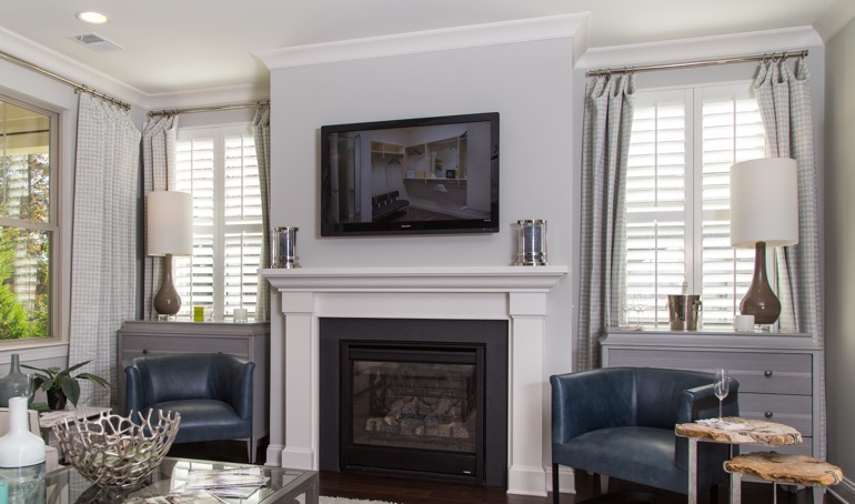 Destin fireplace with plantation shutters.